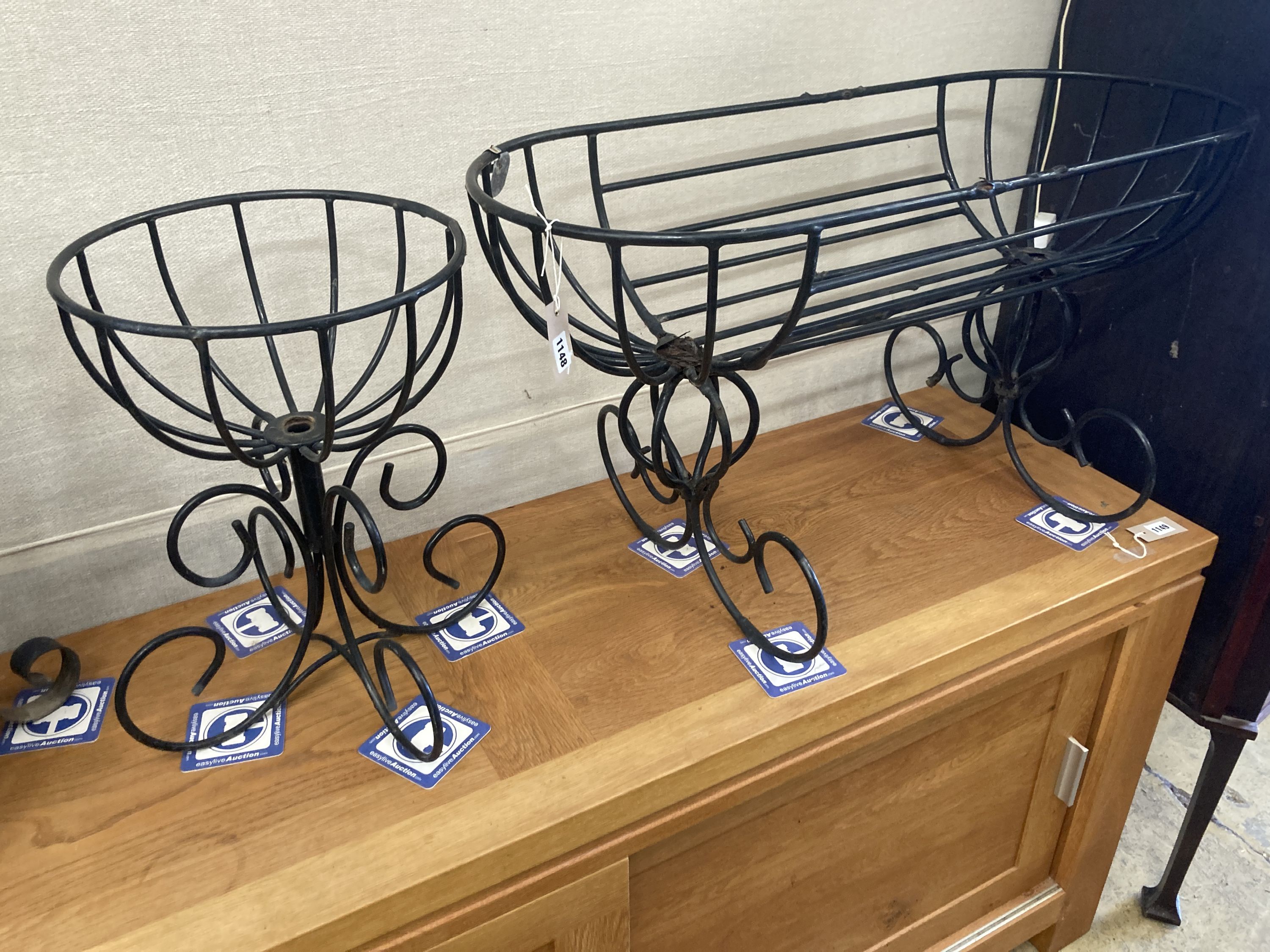 Two painted wrought iron planters, larger width 91cm, depth 38cm, height 50cm